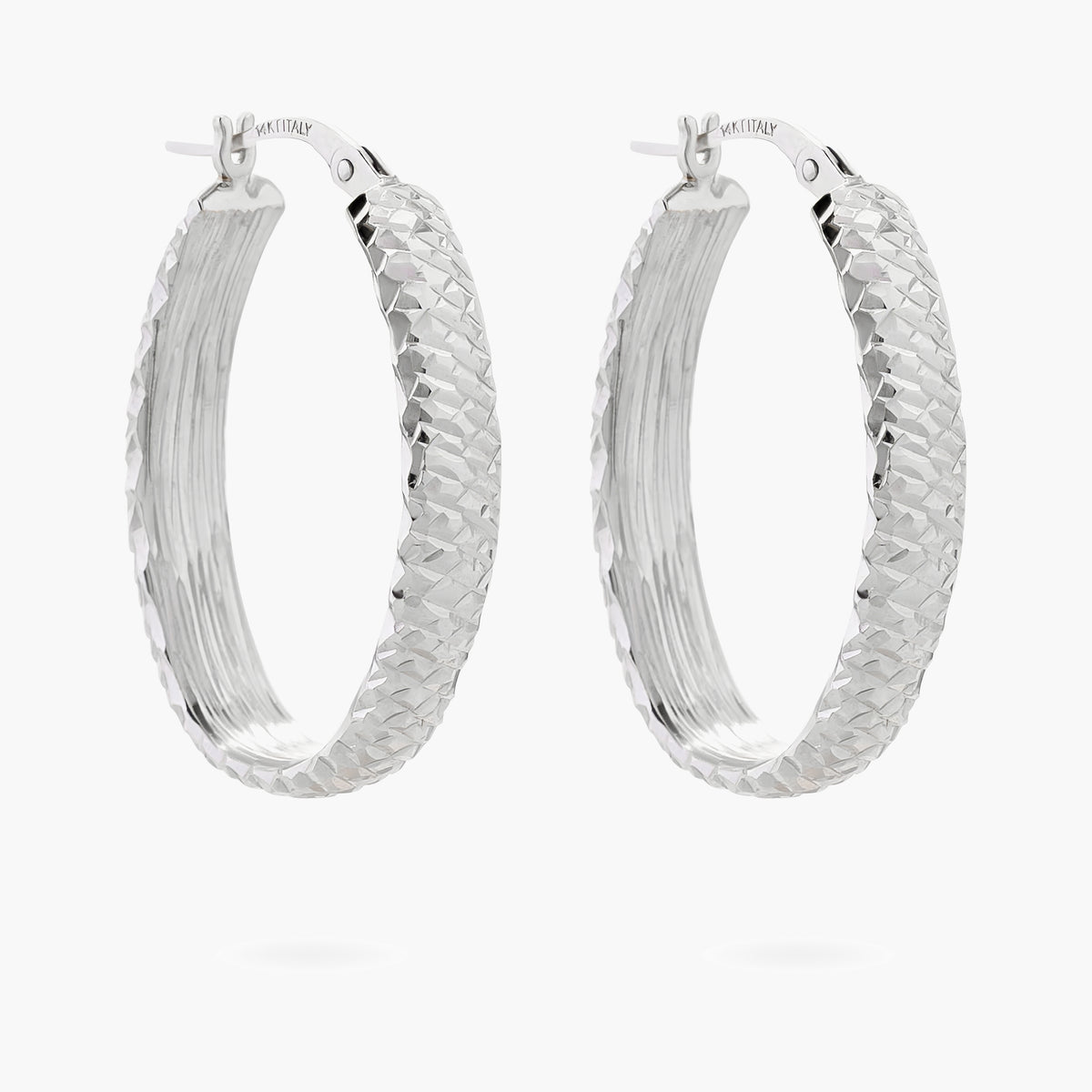 Diamond cut oval hoop earrings