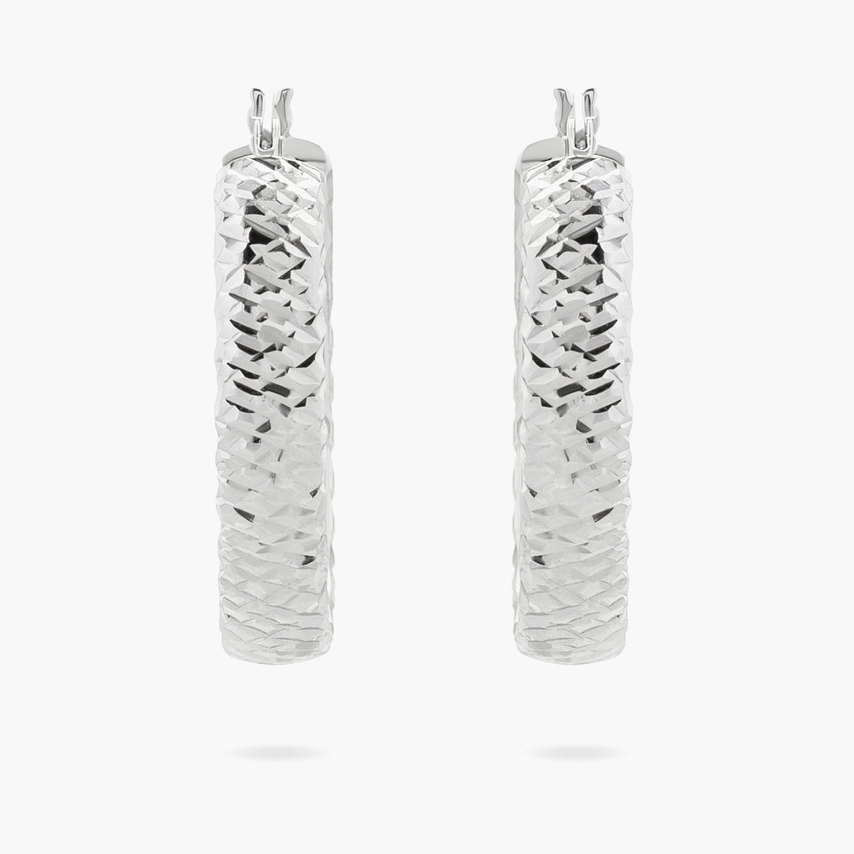 Diamond cut oval hoop earrings