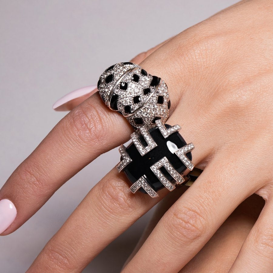 Diamond and onyx rings worn on hand